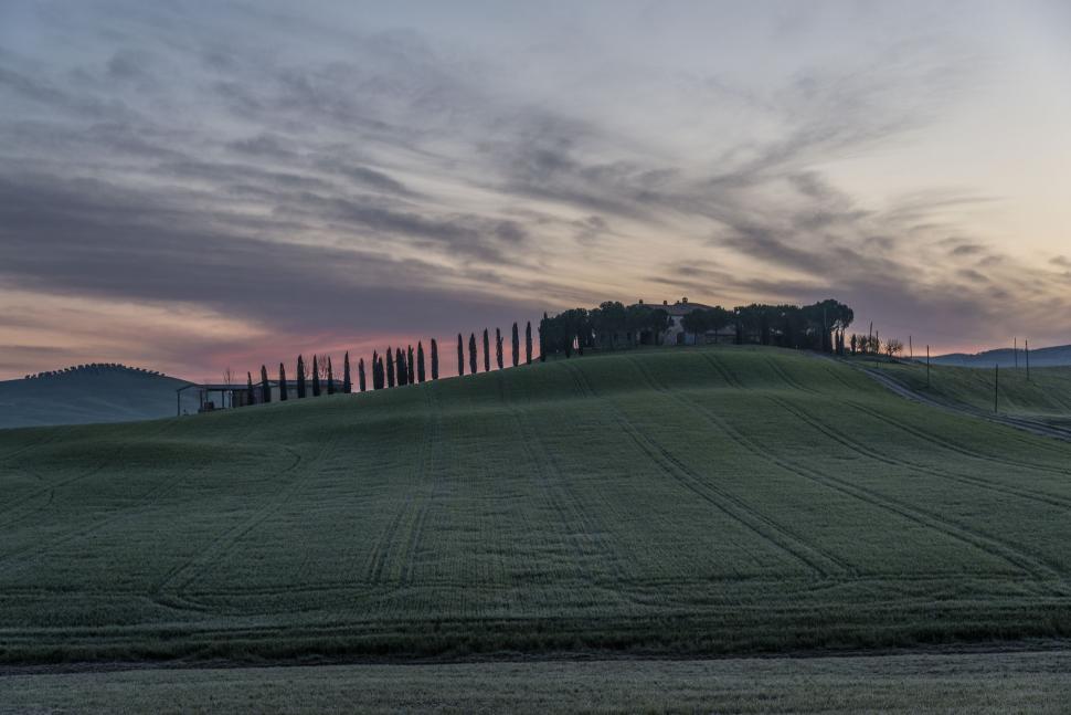 Free Image of House Atop Large Field 
