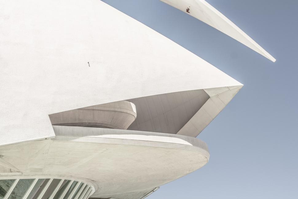 Free Image of Plane Flying Over a Building 