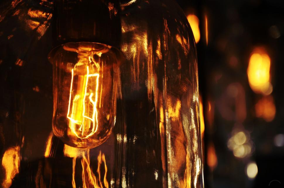 Free Image of Close-Up of a Light Bulb in a Dark Room 