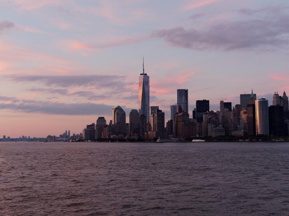 Free Image of City Skyline Across Large Body of Water 