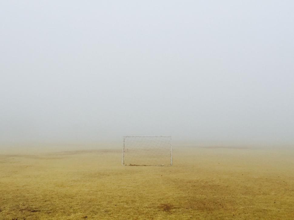 Free Image of Person Flying Kite on Foggy Day 