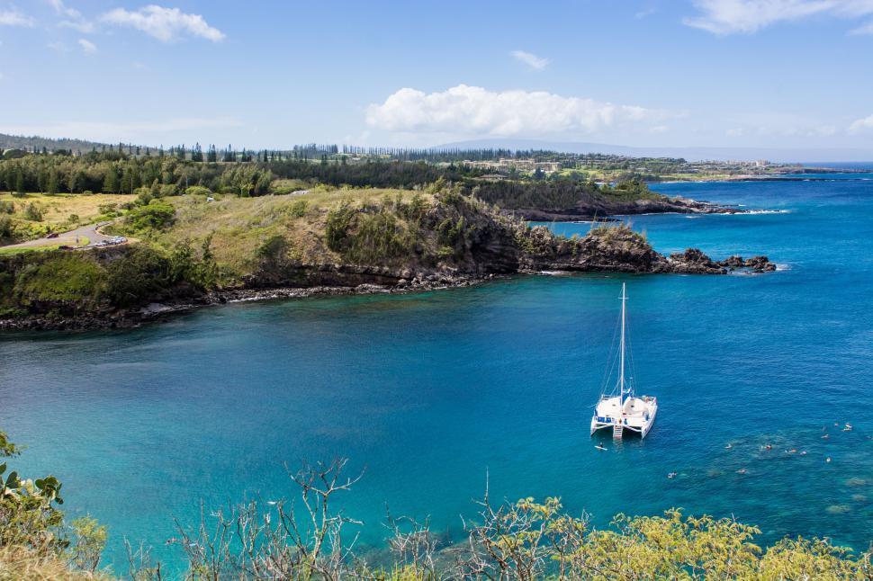 Free Image of Sailboat Floating on Blue Water 