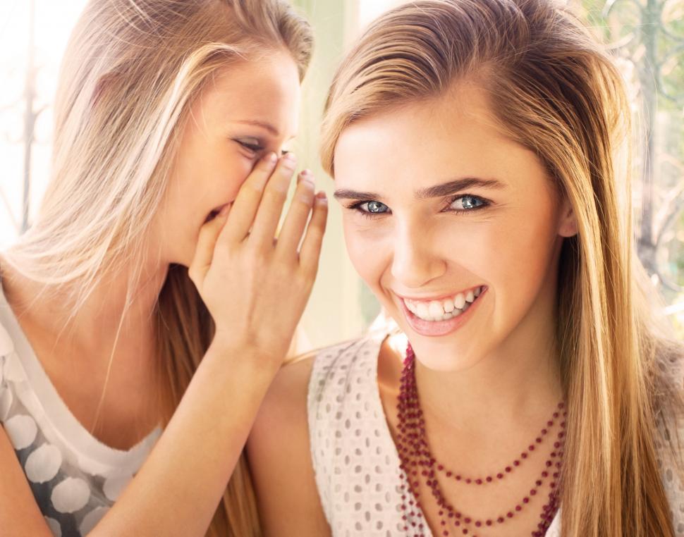 Free Image of Two Beautiful Young Women Standing Next to Each Other 