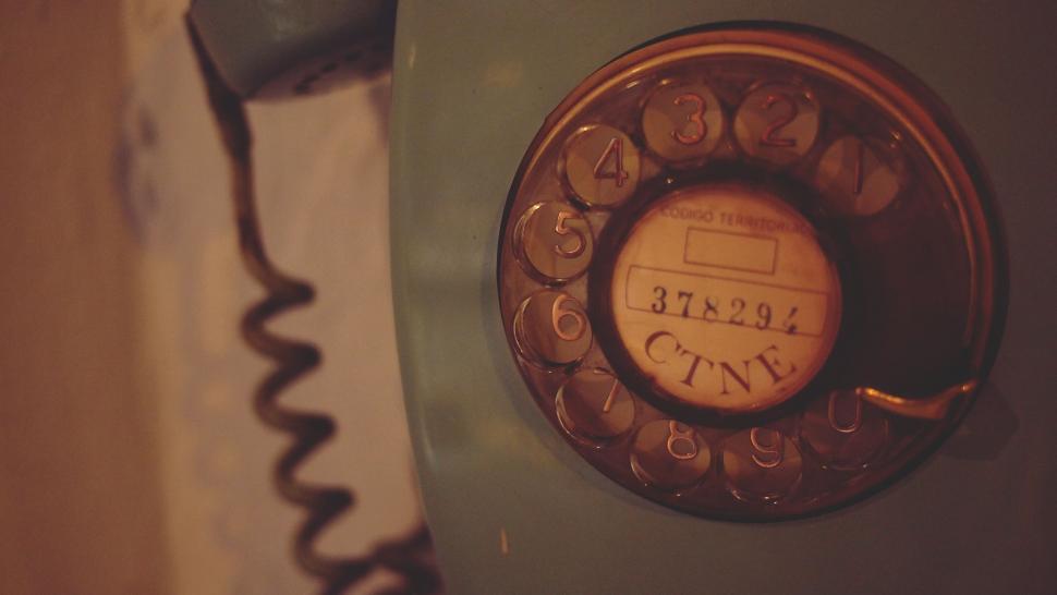 Free Image of Vintage Telephone Hanging on Wall 
