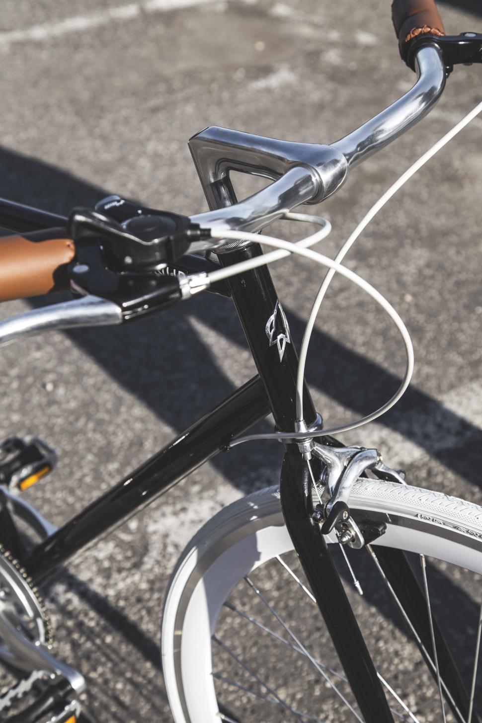 Free Image of Close Up of a Bike Parked on the Street 