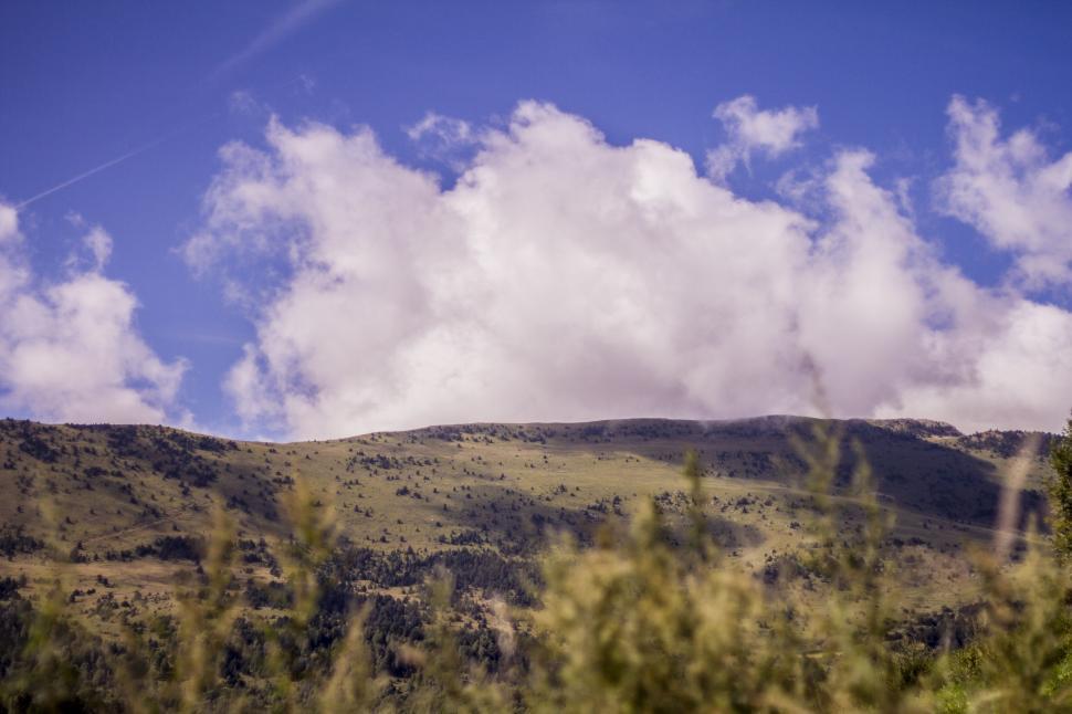 Free Image of Majestic Mountain Peak Surrounded by Clouds 