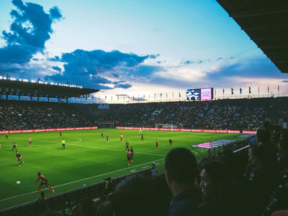 Free Image of Group of People Playing a Game of Soccer 