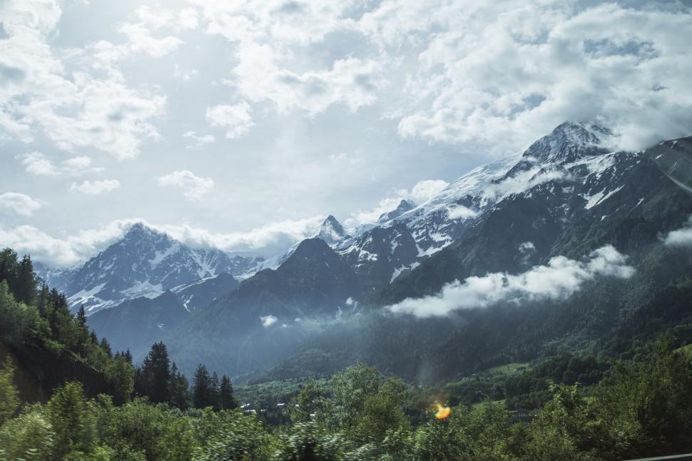 Free Image of Majestic Mountain Range Under Cloudy Sky 