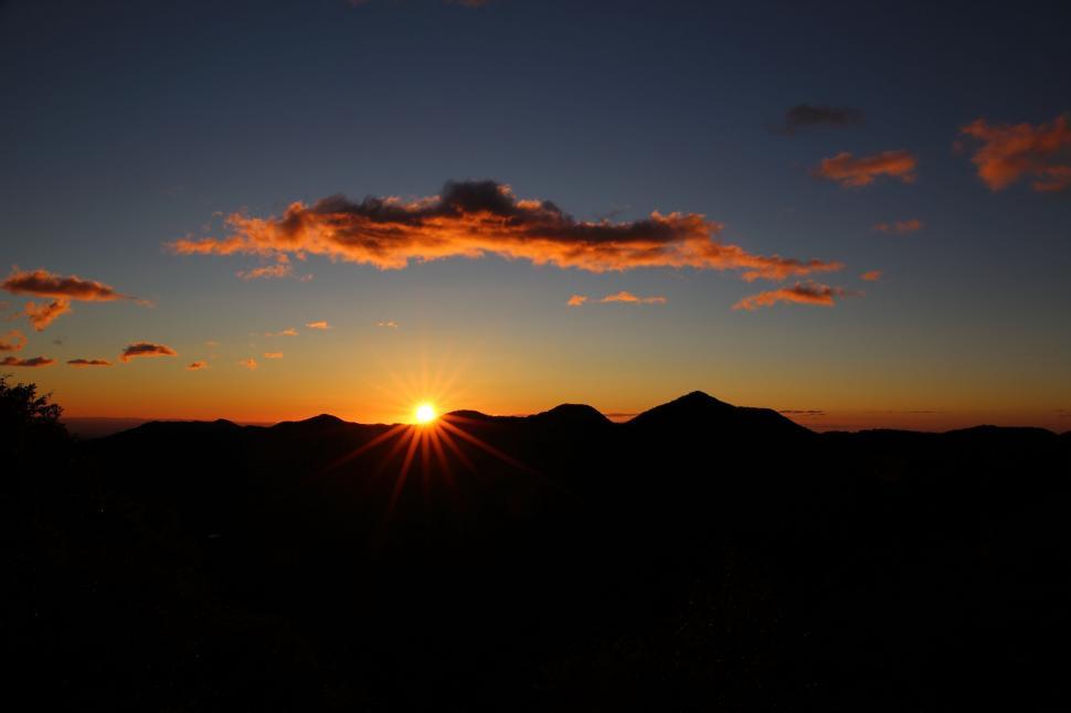 Free Image of Sun Setting Over Mountain Range 
