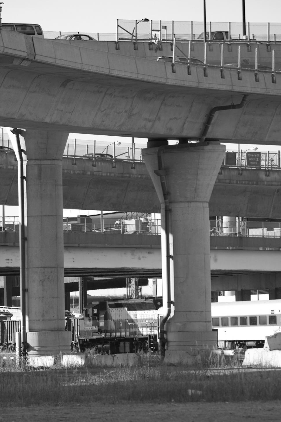 Free Image of Train Passing Under Bridge 