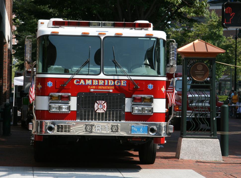 Free Image of Red and White Fire Truck Parked on Side of Road 