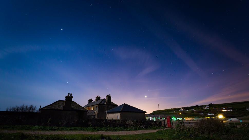 Free Image of Night Time View of Building With Sky in Background 