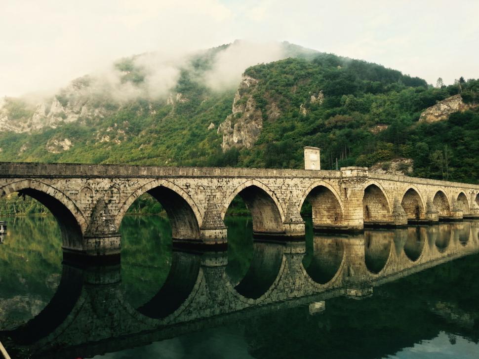 Free Image of Stone Bridge Spanning Over River 