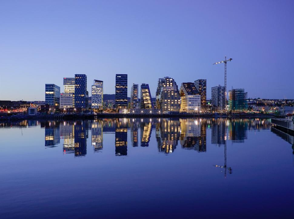 Free Image of City Skyline Across Vast Body of Water 