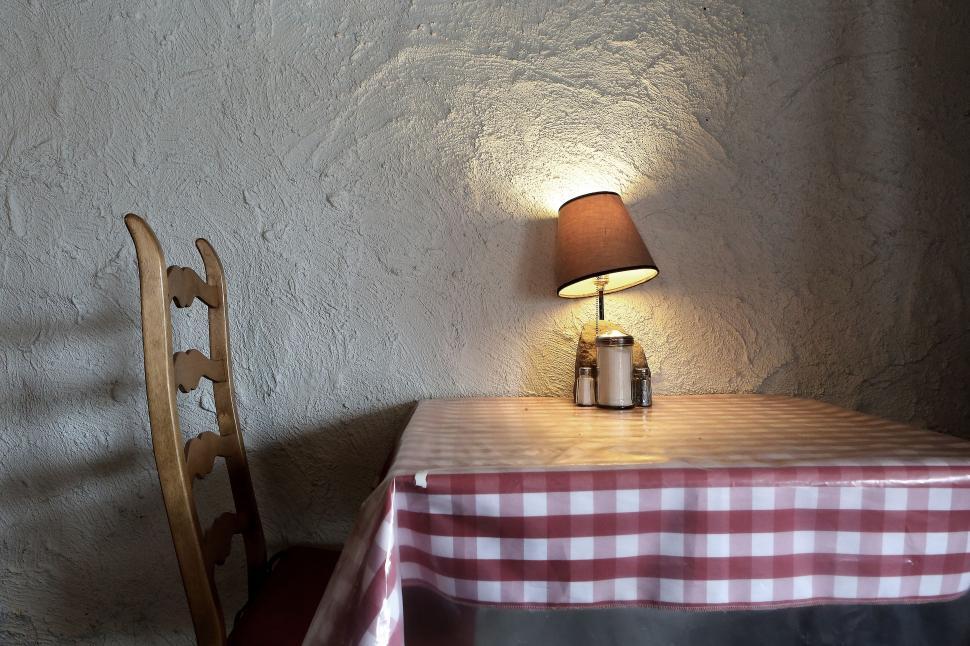 Free Image of Table With Lamp Next to Chair 