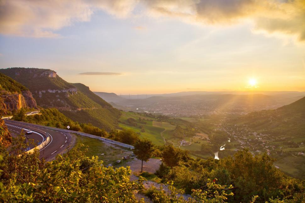 Free Image of Sun Setting Over Mountain Valley 