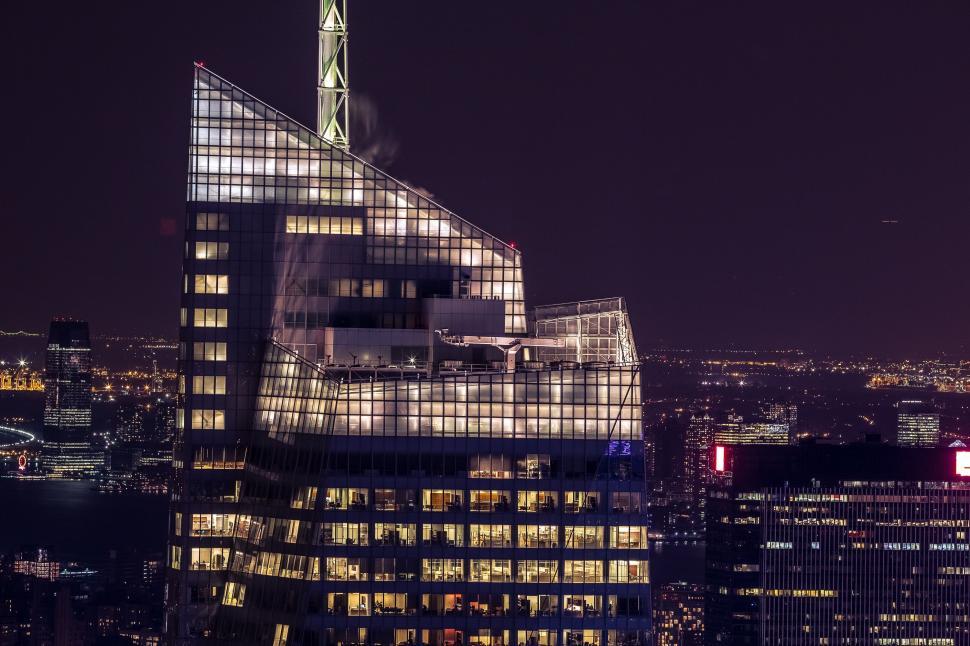 Free Image of Tall Building With Many Windows Lit Up at Night 