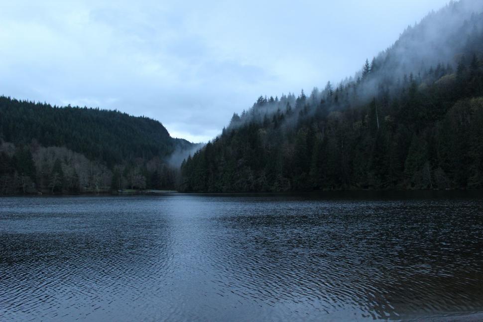 Free Image of Majestic Mountain Lake Amidst Lush Forest 
