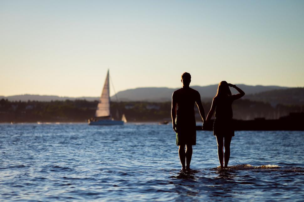 Free Image of Man and Woman Standing in Water 