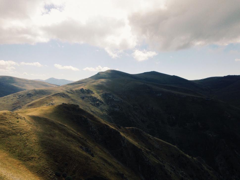 Free Image of A Panoramic View of a Mountain Range From a High Vantage Point 