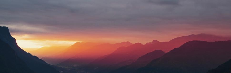 Free Image of Sun Setting Over Mountain Range 