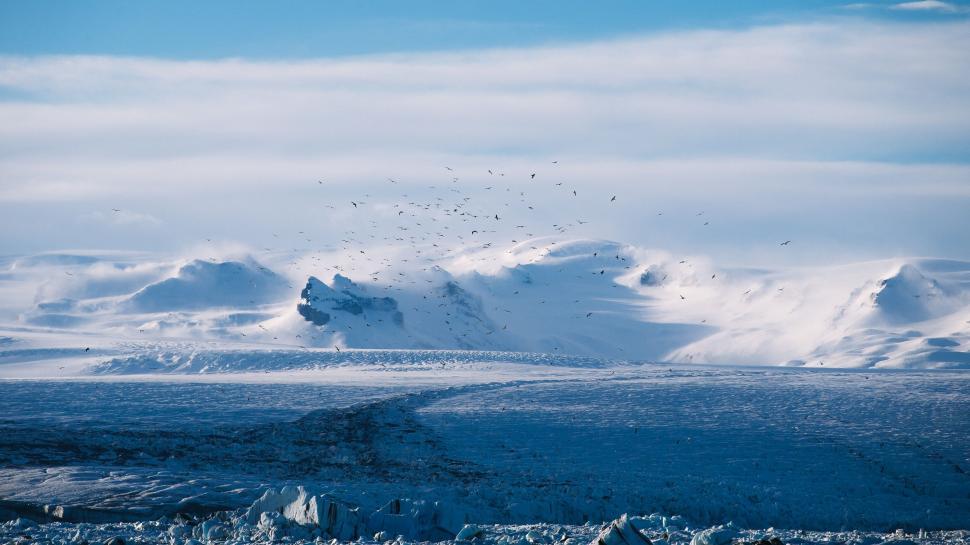 Free Image of Snow-Covered Mountain Under Blue Sky 