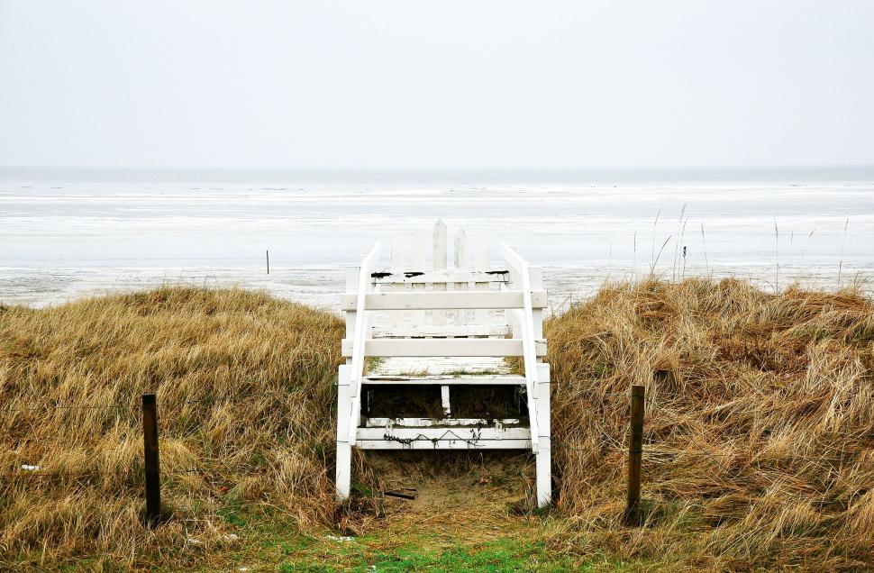 Free Image of White Chair on Pile of Hay 
