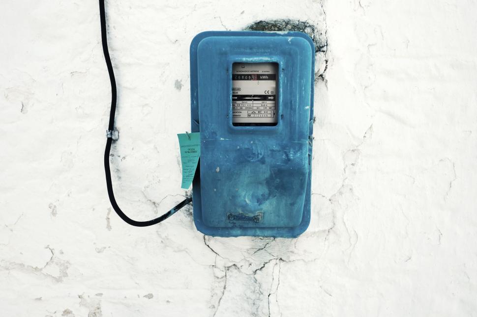 Free Image of Blue Phone on White Wall 