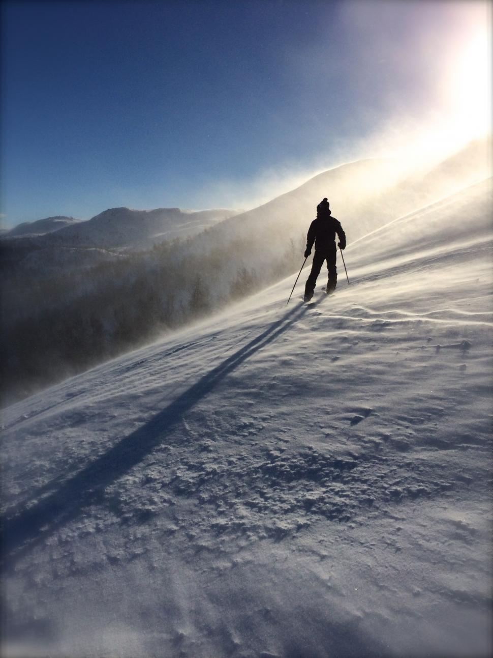 Free Image of Person Skiing Down Snow Covered Slope 