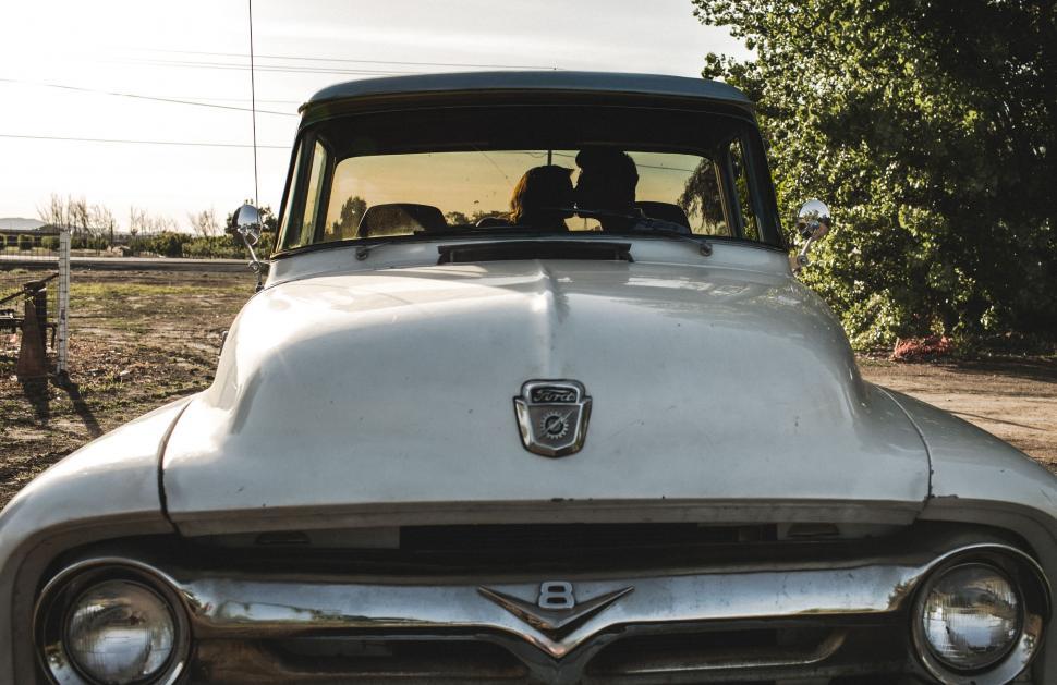 Free Image of Old White Truck Parked on Side of Road 