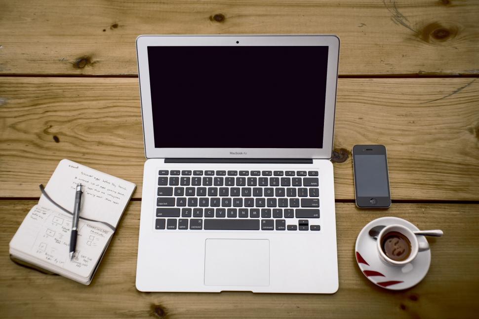 Free Image of Open Laptop Computer on Wooden Table 