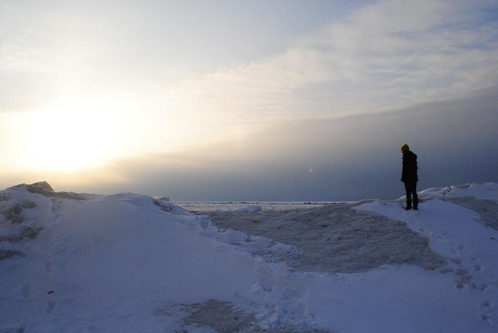 Free Image of Man Standing on Snow Covered Slope 