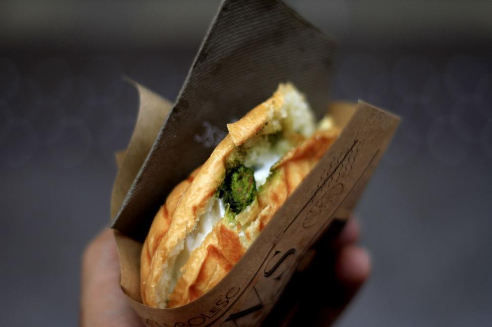 Free Image of Person Holding Piece of Food 