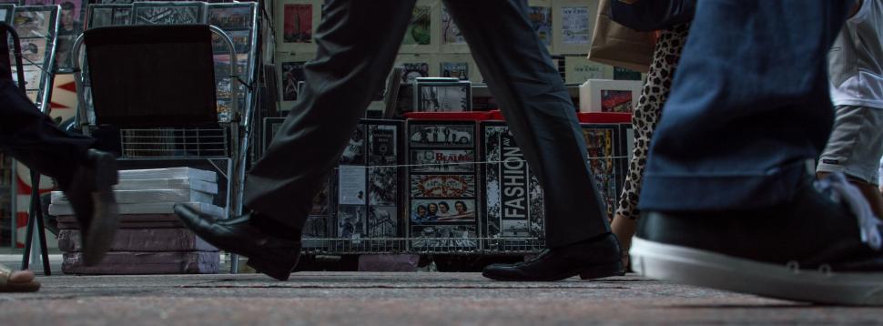 Free Image of Two People Walking Down a Sidewalk 