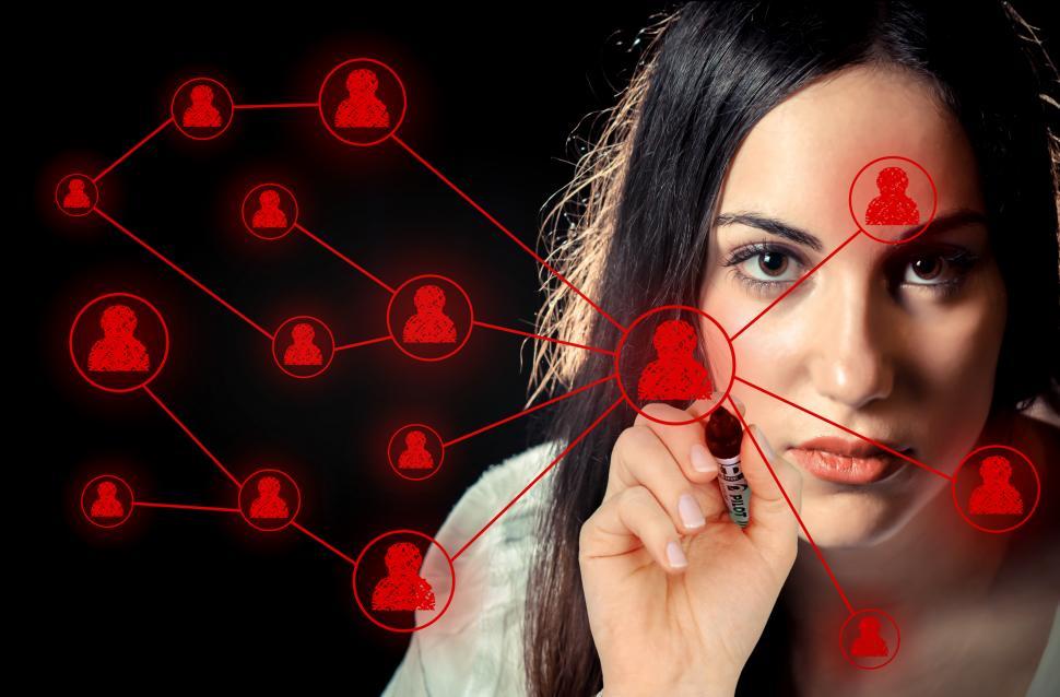 Free Image of Woman sketching a social network on virtual screen 