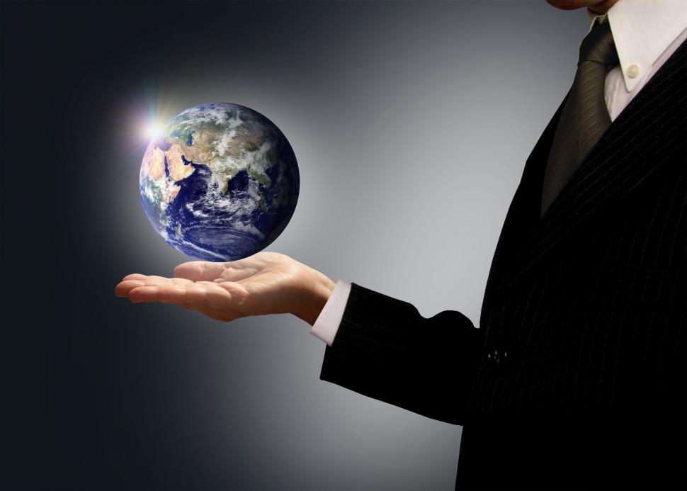 Free Image of Businessman holding Earth globe - Globalization concept 