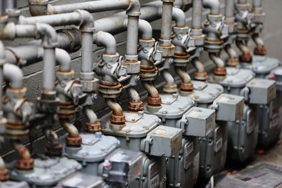 Free Image of Array of Pipes Mounted on Wall 