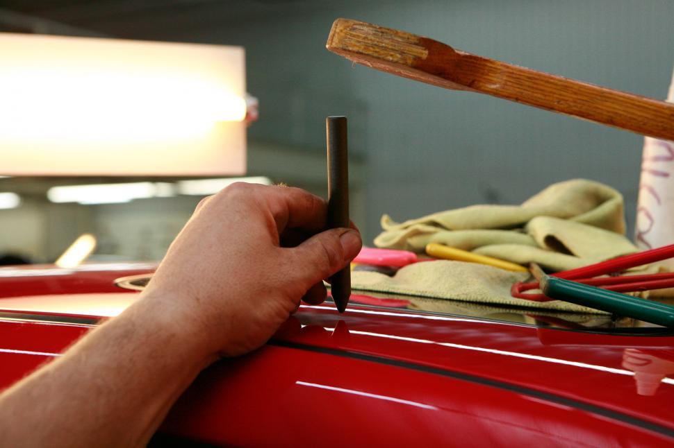 Free Image of Man Working on Car in Garage 