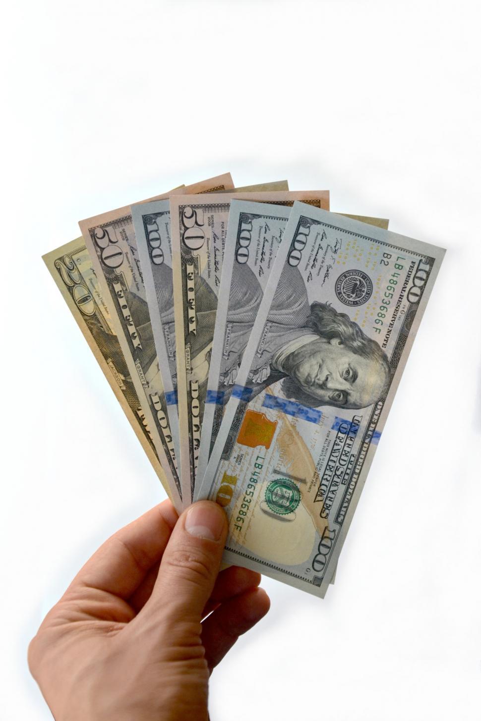 Free Image of Dollars in his hand.  