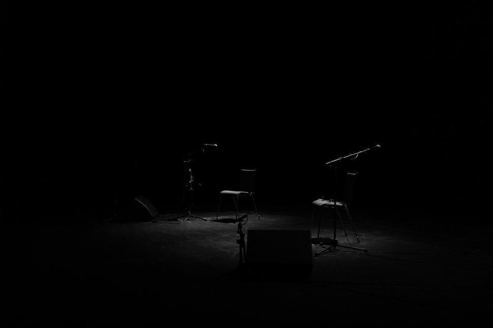 Free Image of Two Chairs in the Dark 