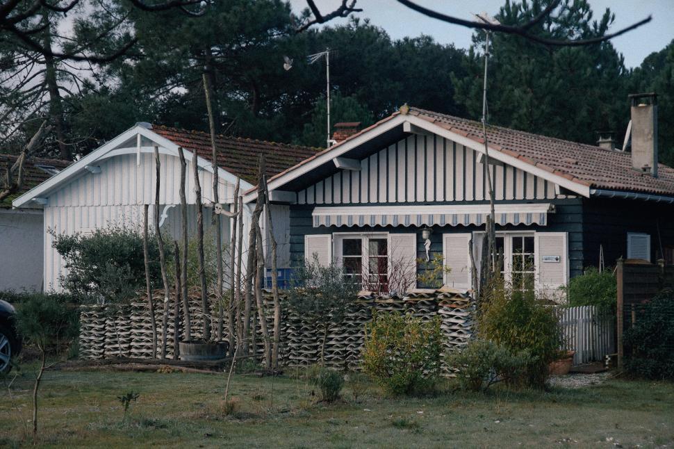 Free Image of A Car Parked in Front of a House 