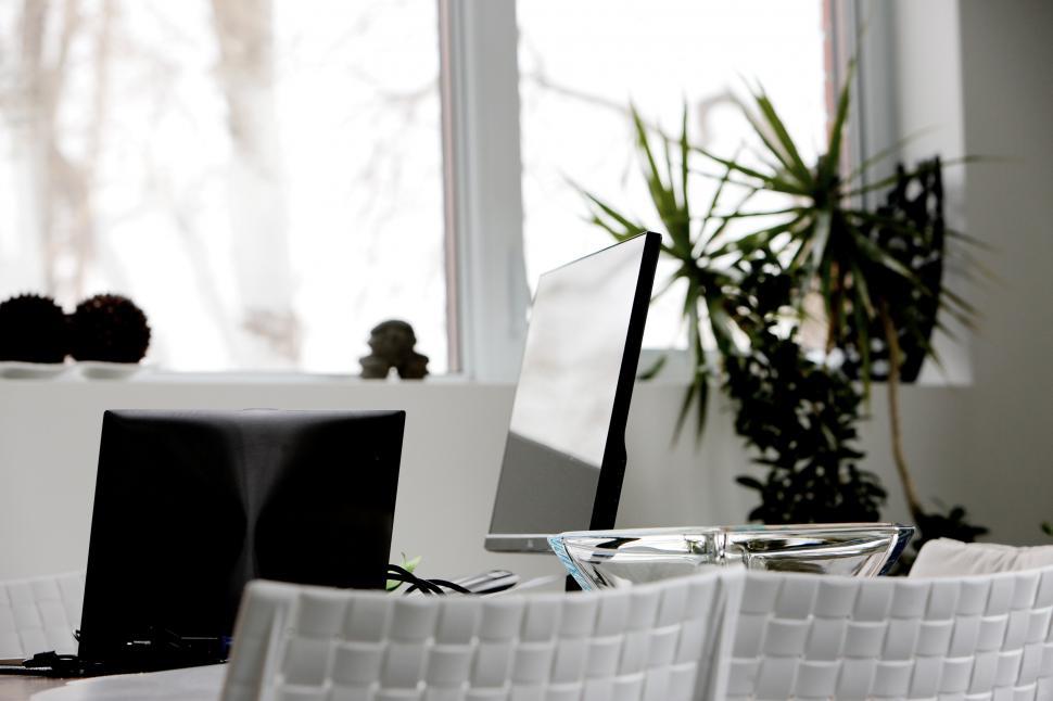 Free Image of A Black and White Photo of a Table and Chairs 