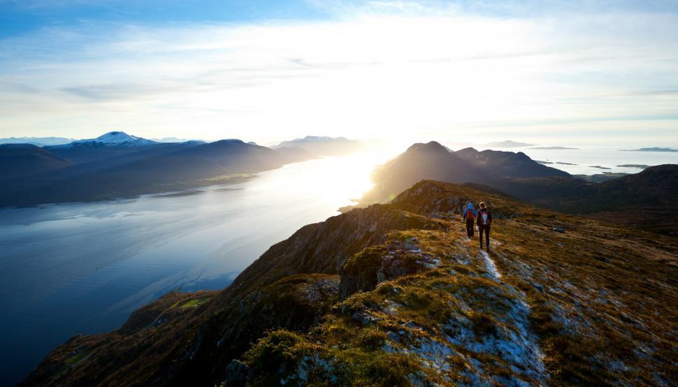 Free Image of Couple Standing on Top of Mountain 