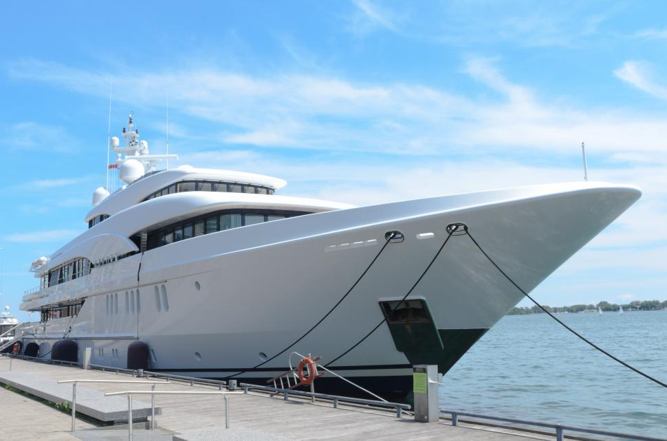 Free Image of Large White Boat Docked at Pier 