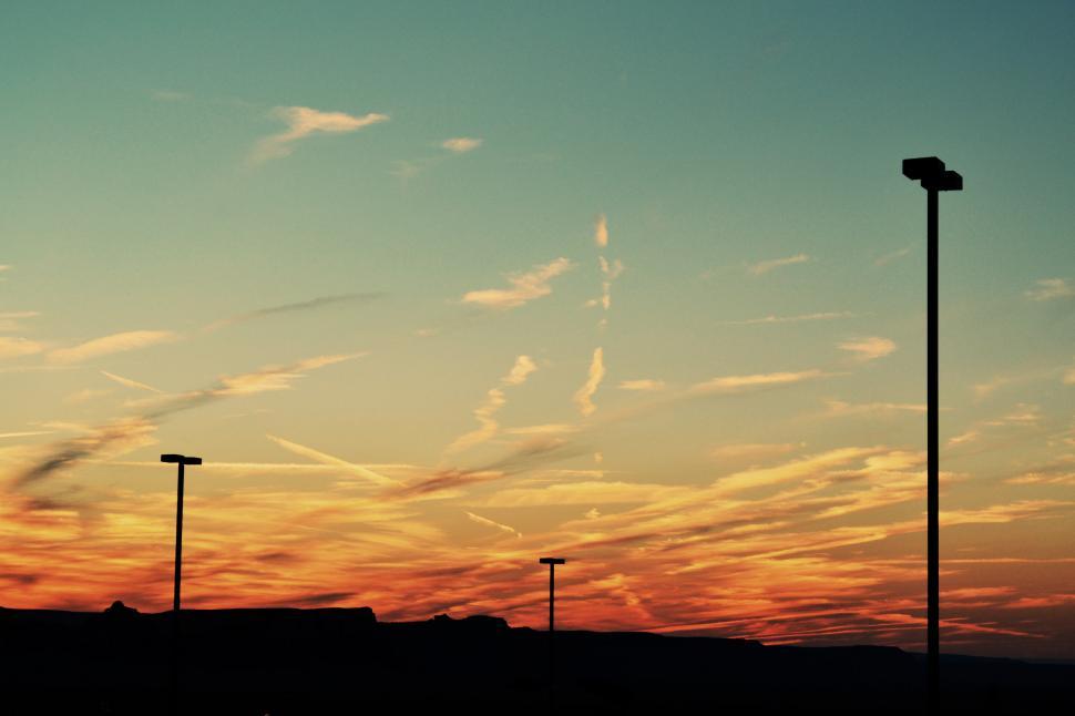 Free Image of Sun Setting Over Parking Lot 