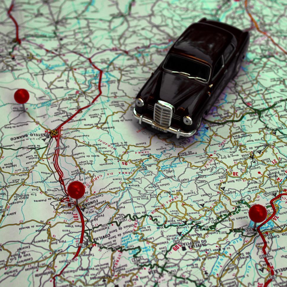 Free Image of Miniature car and pushpins on a map - Travel concept 