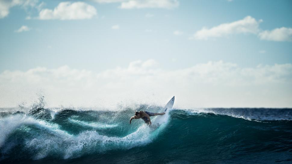 Free Image of Person Riding Surfboard on Ocean Wave 