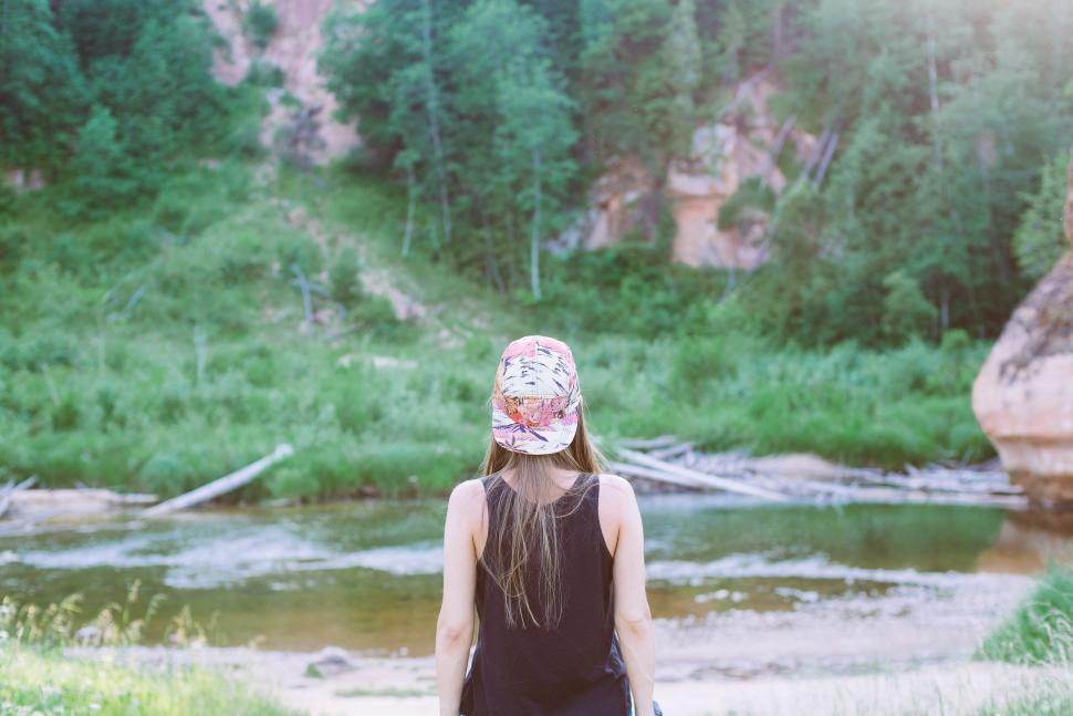 Free Image of Woman Standing in Front of River 