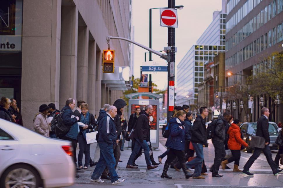 Free Image of Group of People Walking Across a Street 