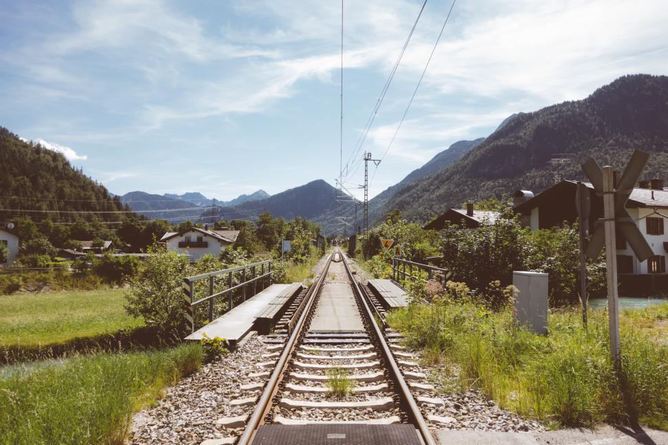 Free Image of Train Track Across Lush Green Countryside 